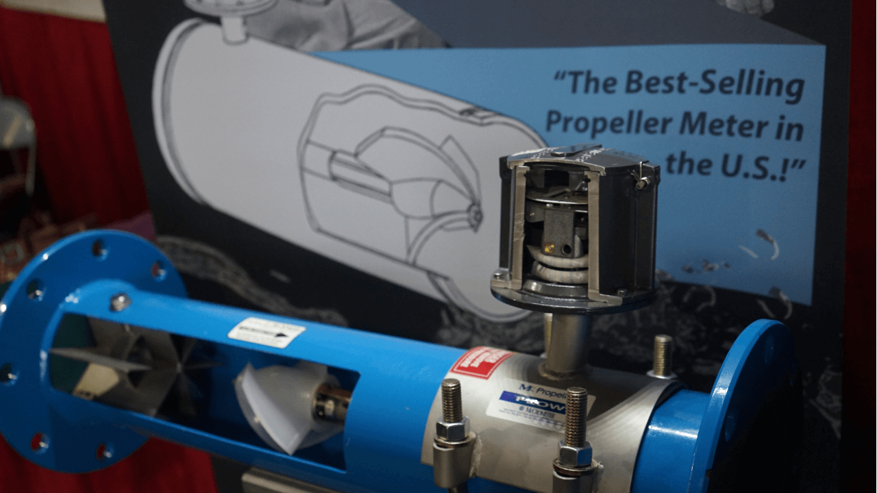 Image of a blue meter in front of a graphic drawing.