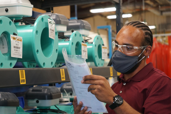 Memphis Huff V, Product Manager for McCrometer’s electromagnetic meters product line, inspects new Dura Mag meters. Courtesy of McCrometer.
